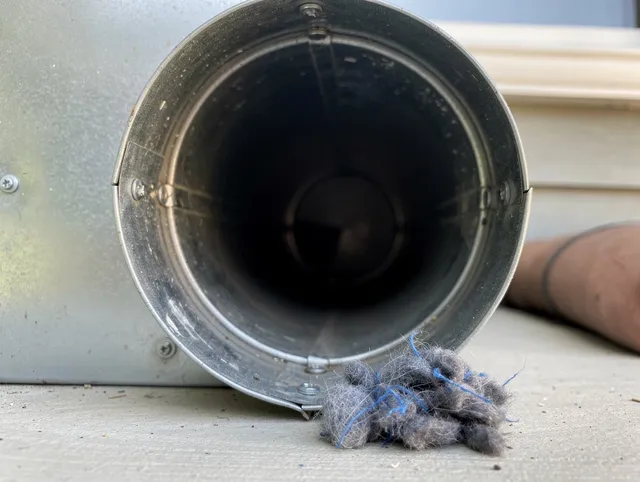 Buckeye Dryer Vent Cleaning technician using specialized equipment to clear severe dryer vent blockage in Buckeye